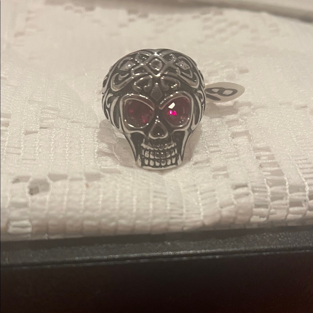 Intricate Silver Skull Ring with Red Accents